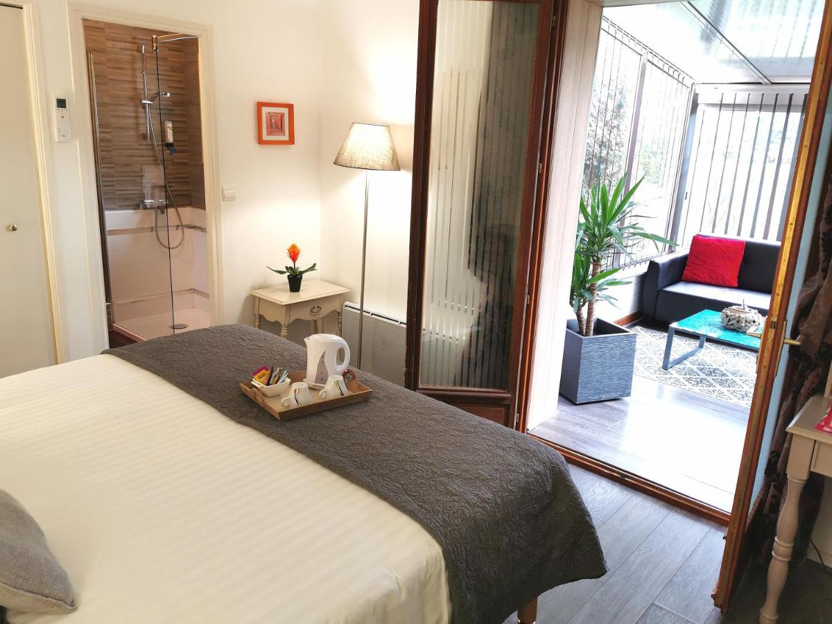 Un ou plusieurs lits dans un hébergement de l'établissement Les Terrasses de Saumur - Hôtel & Appartements - Restaurant & Spa (Logis)