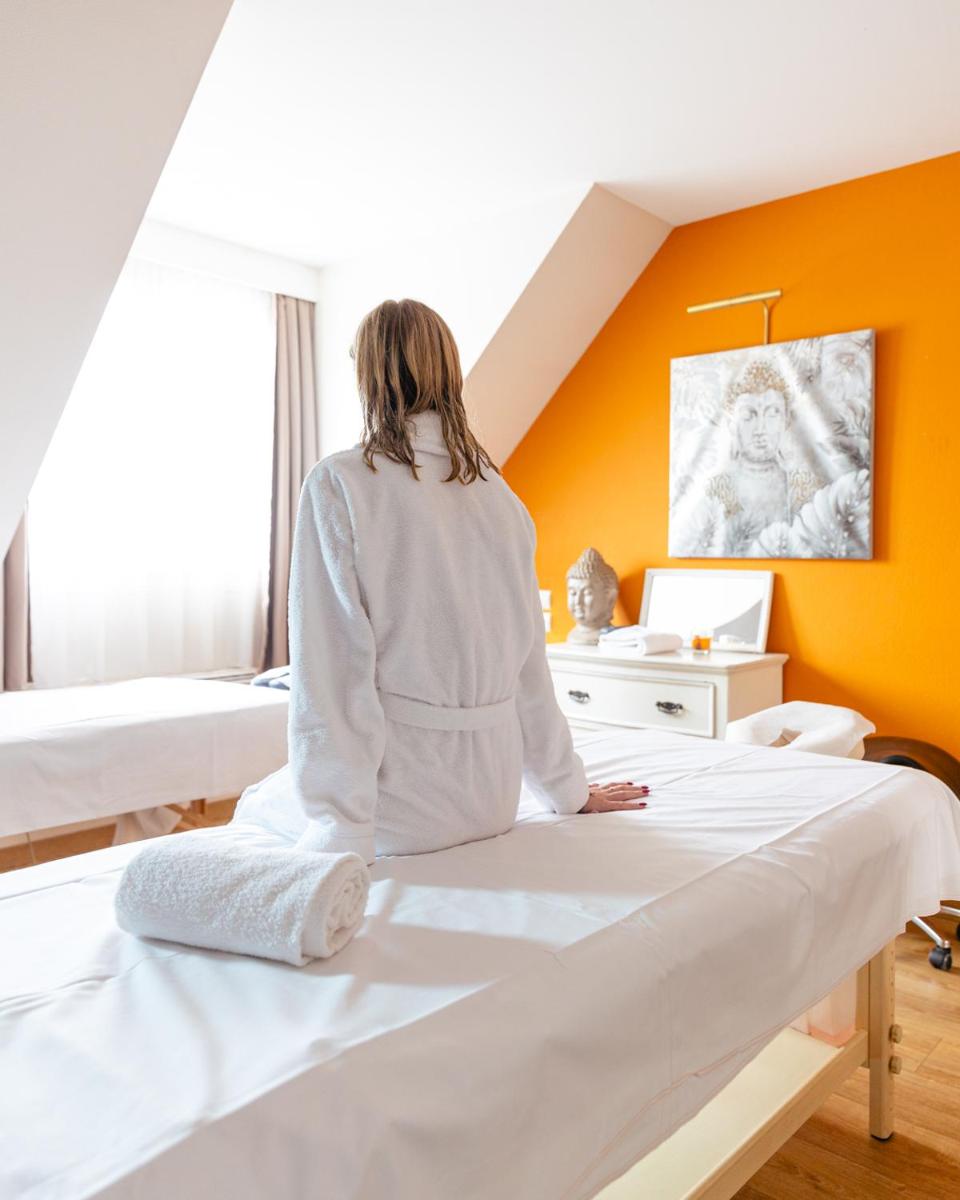 Un ou plusieurs lits dans un hébergement de l'établissement Tulip Inn Honfleur Residence & Spa