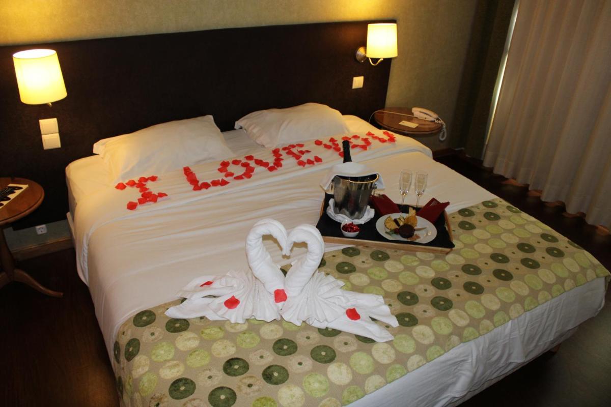 Uma cama ou camas num quarto em Hotel Da Montanha