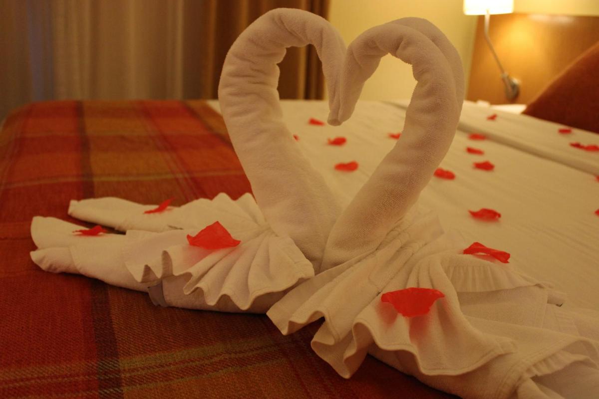 Uma cama ou camas num quarto em Hotel Da Montanha