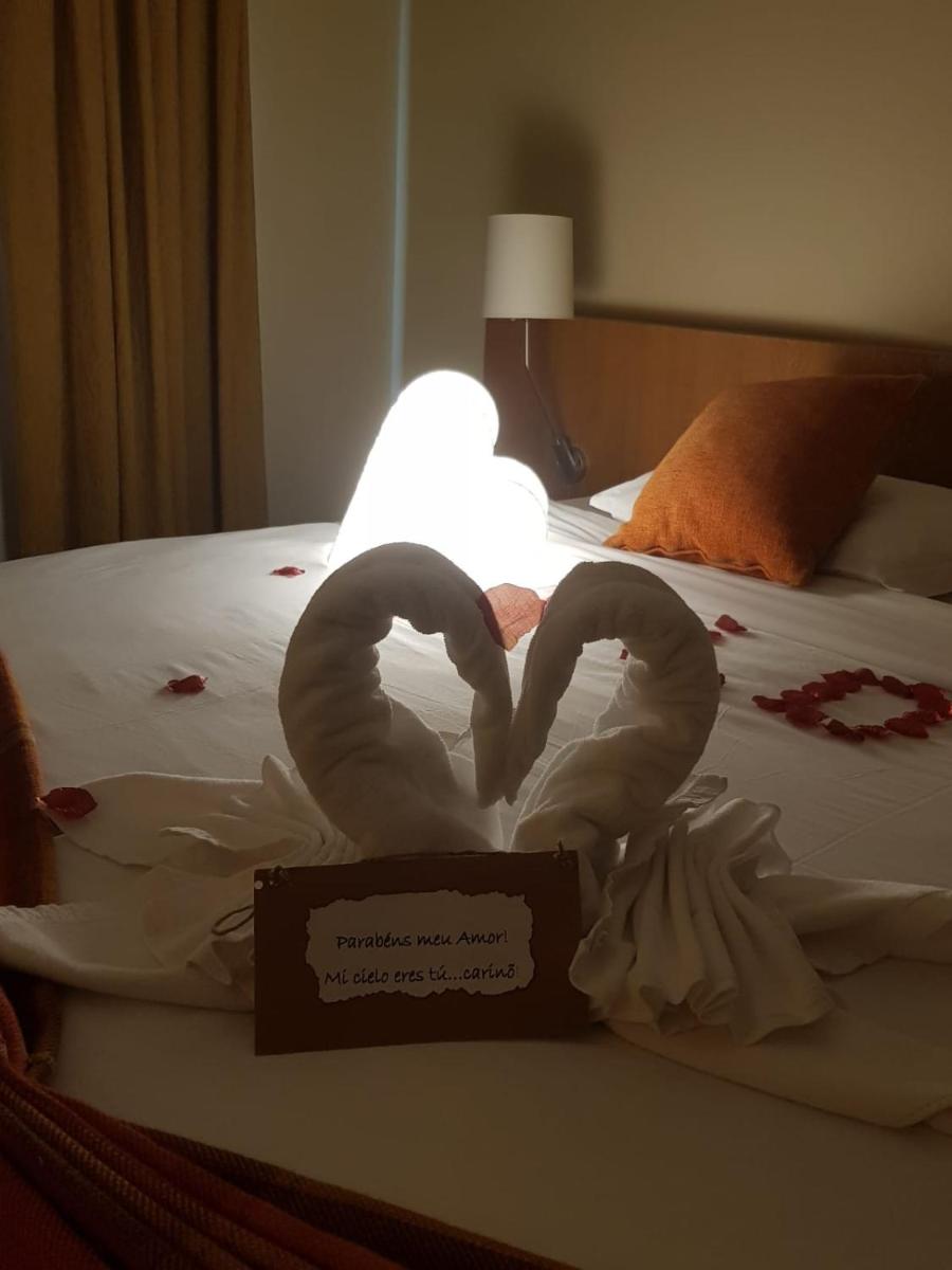 Uma cama ou camas num quarto em Hotel Da Montanha