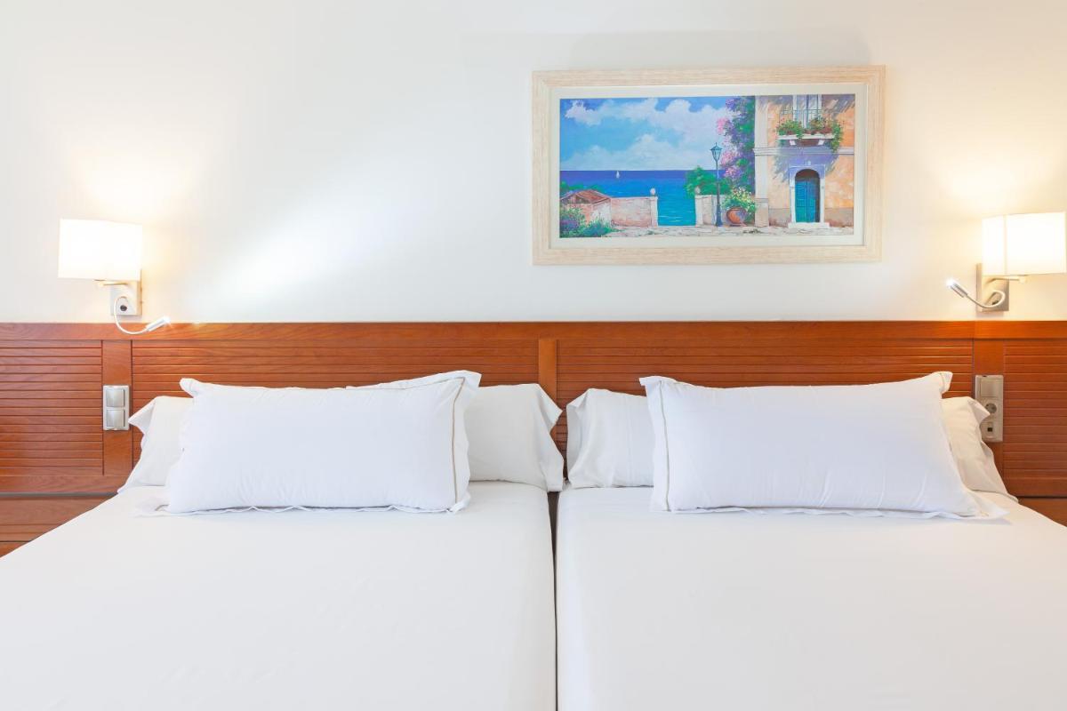 Cama o camas de una habitación en Playamarina