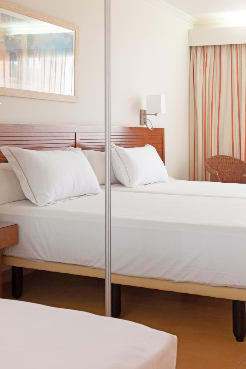 Cama o camas de una habitación en Playamarina