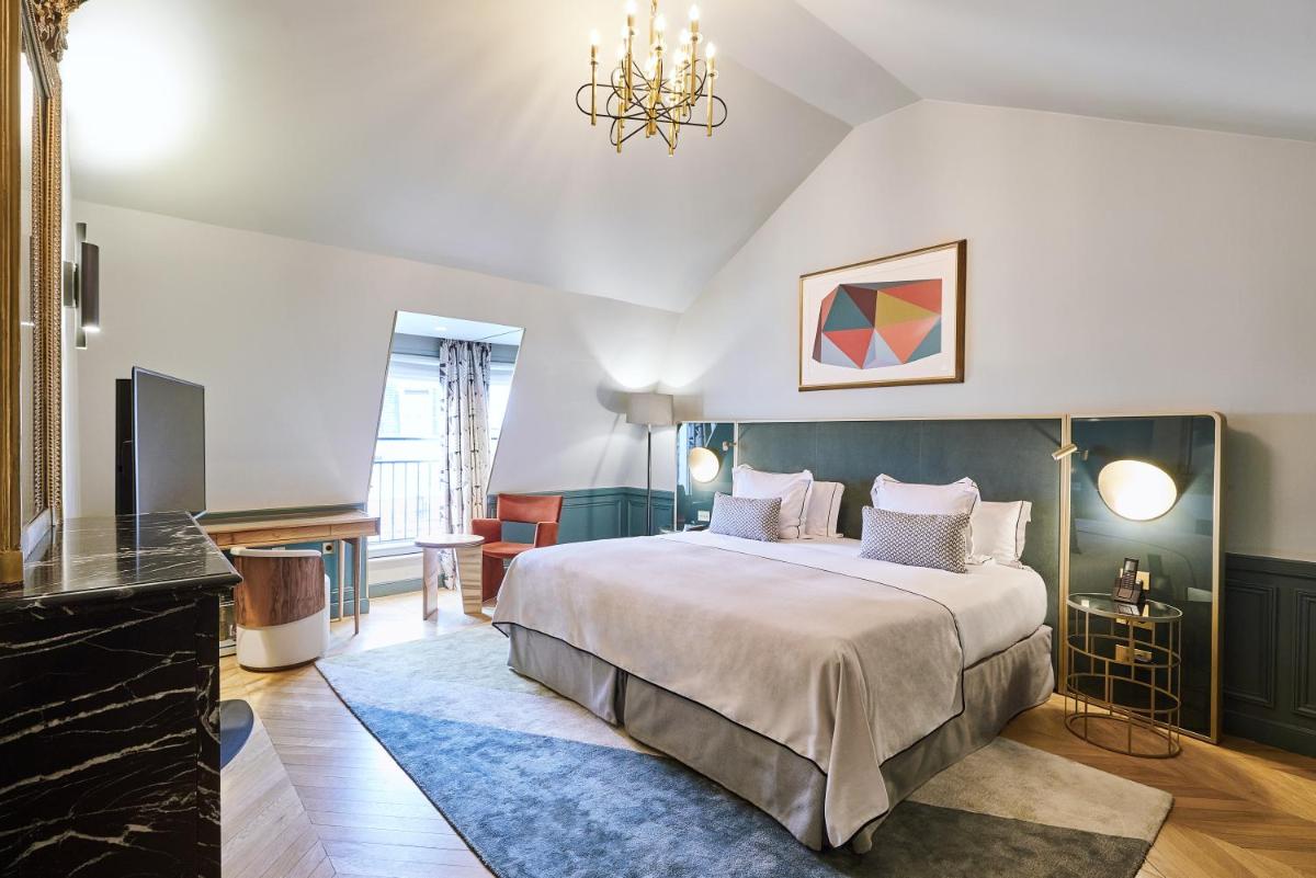 Un ou plusieurs lits dans un hébergement de l'établissement Grand Powers Hotel