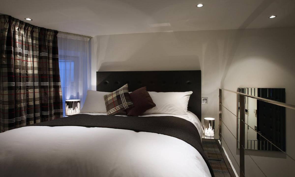 Un ou plusieurs lits dans un hébergement de l'établissement Petit Hôtel Confidentiel