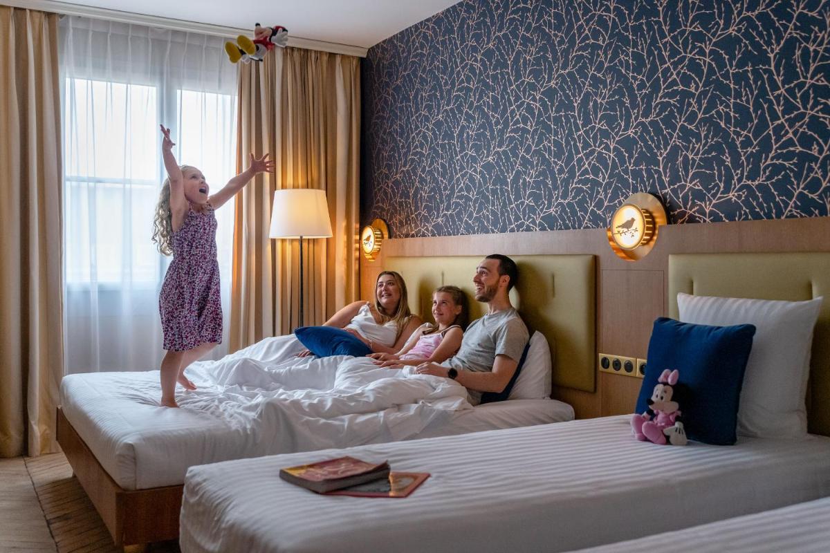 Un ou plusieurs lits dans un hébergement de l'établissement Dream Castle Hotel Marne La Vallee