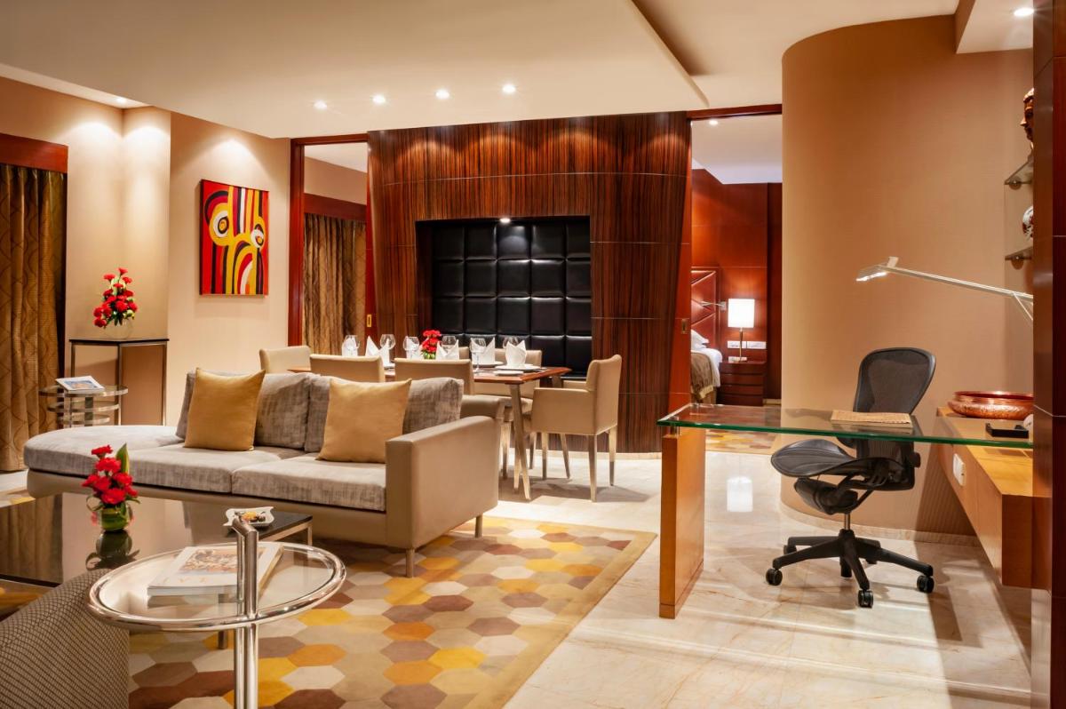 a living room with a couch and a table at Taj Chandigarh in Chandīgarh