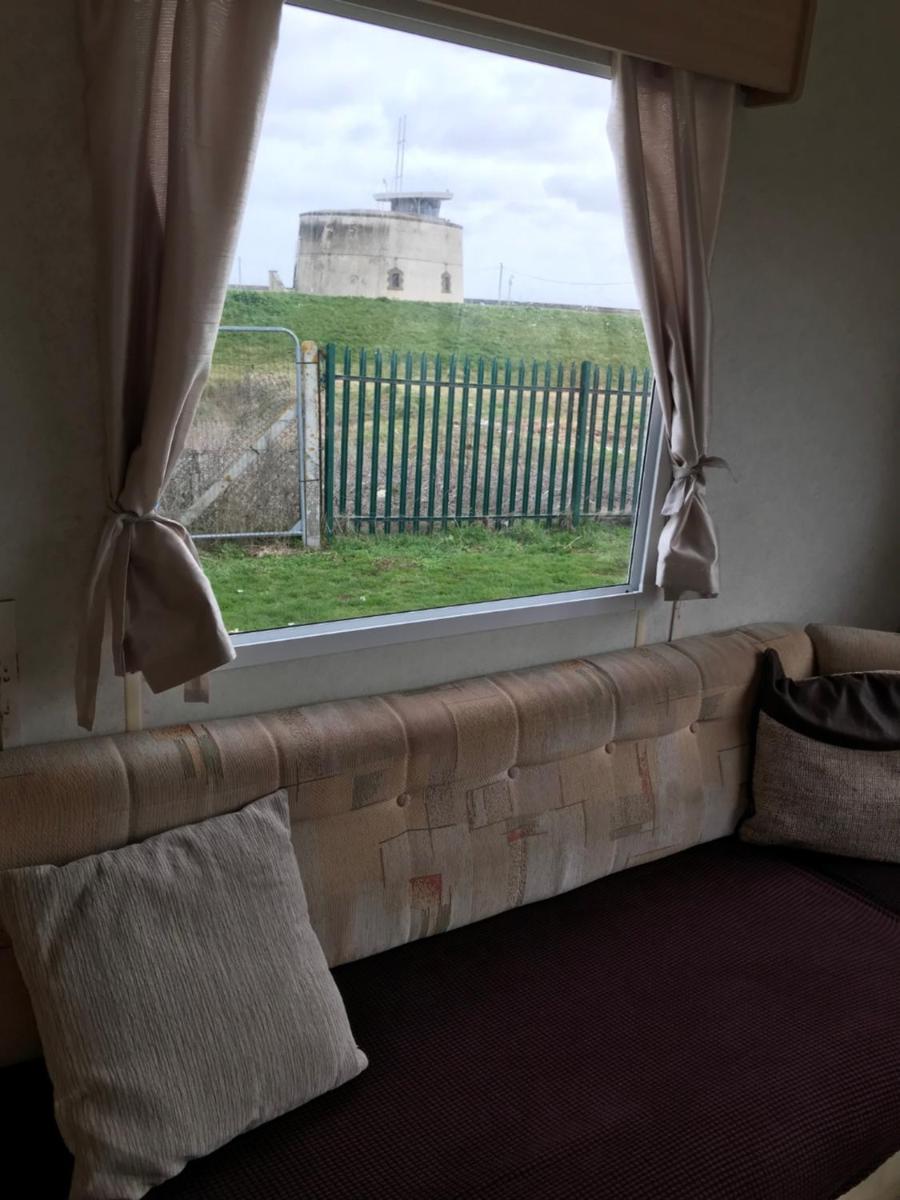 Dotty By The Sea, 27 BW, St Osyth Beach - price is whole caravan with field views - Housity