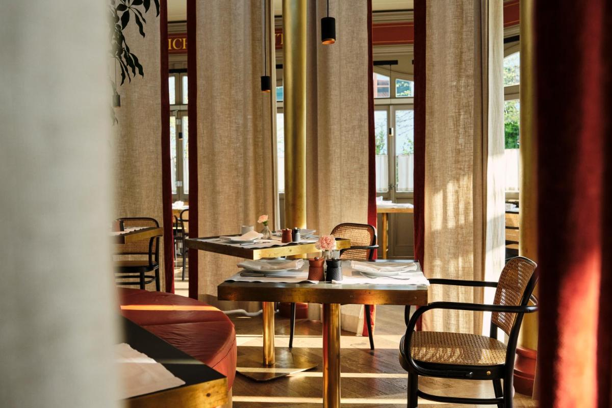 Ein Restaurant oder anderes Speiselokal in der Unterkunft Spa & Resort Bachmair Weissach, LUXURY FAMILY RESORT