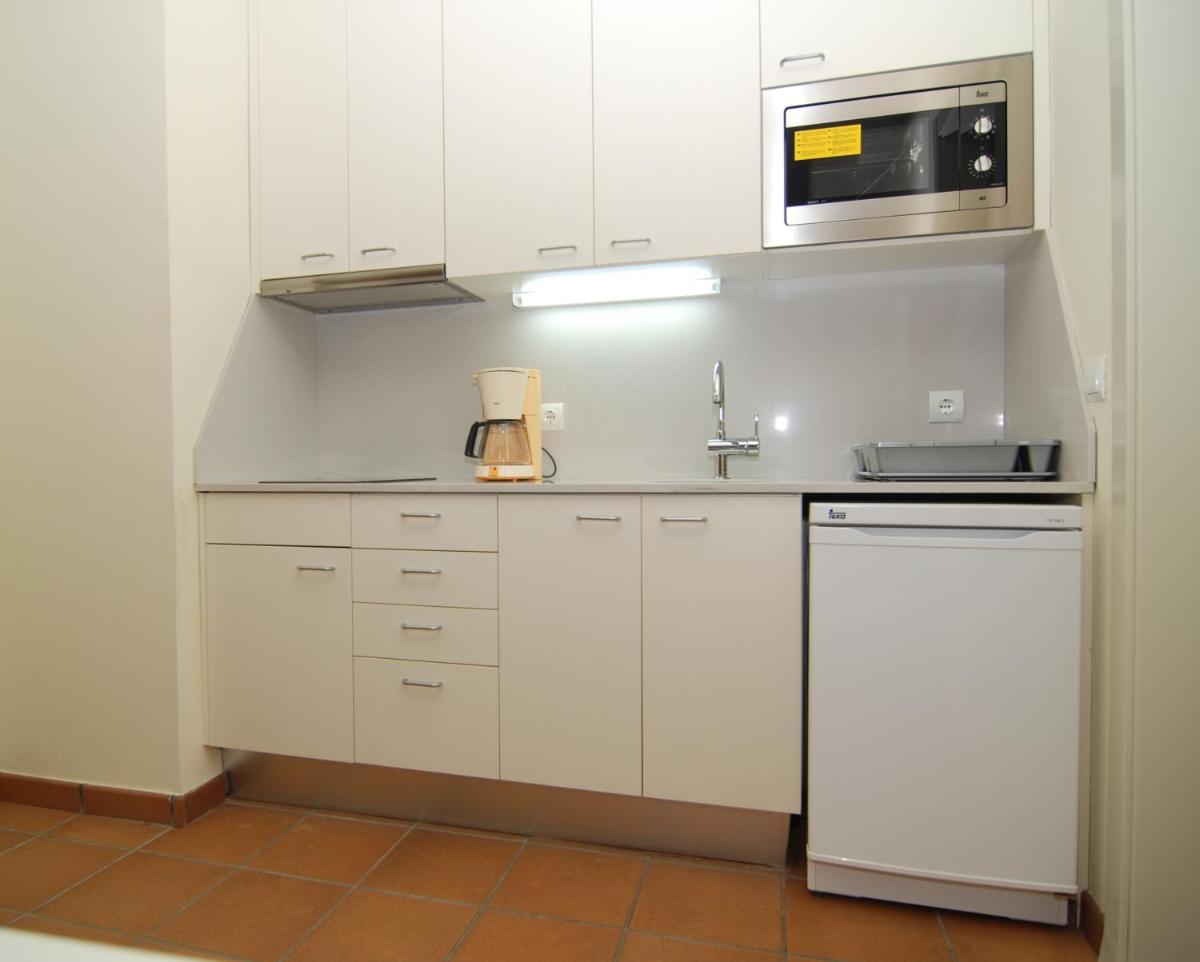 Una cocina o zona de cocina en Aparthotel Ciutat de Palol