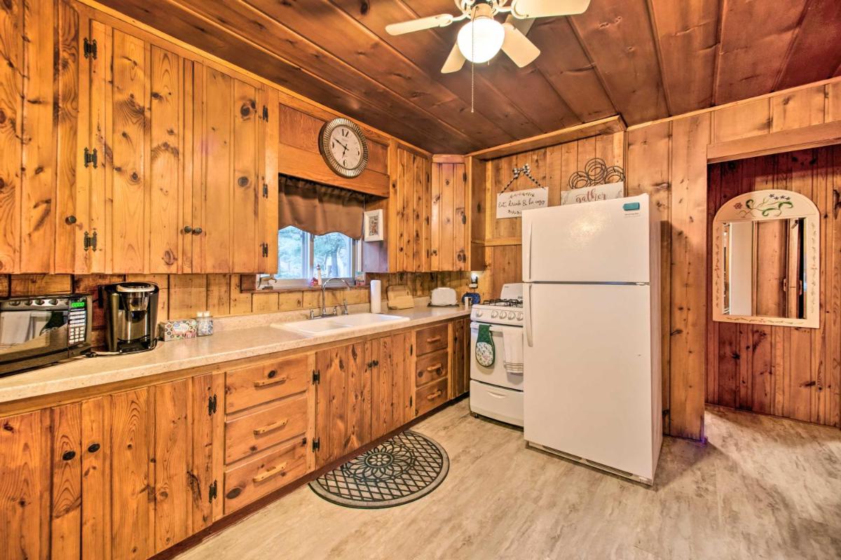 East Tawas Cabin with Deck, Backyard and Fire Pit! - Housity
