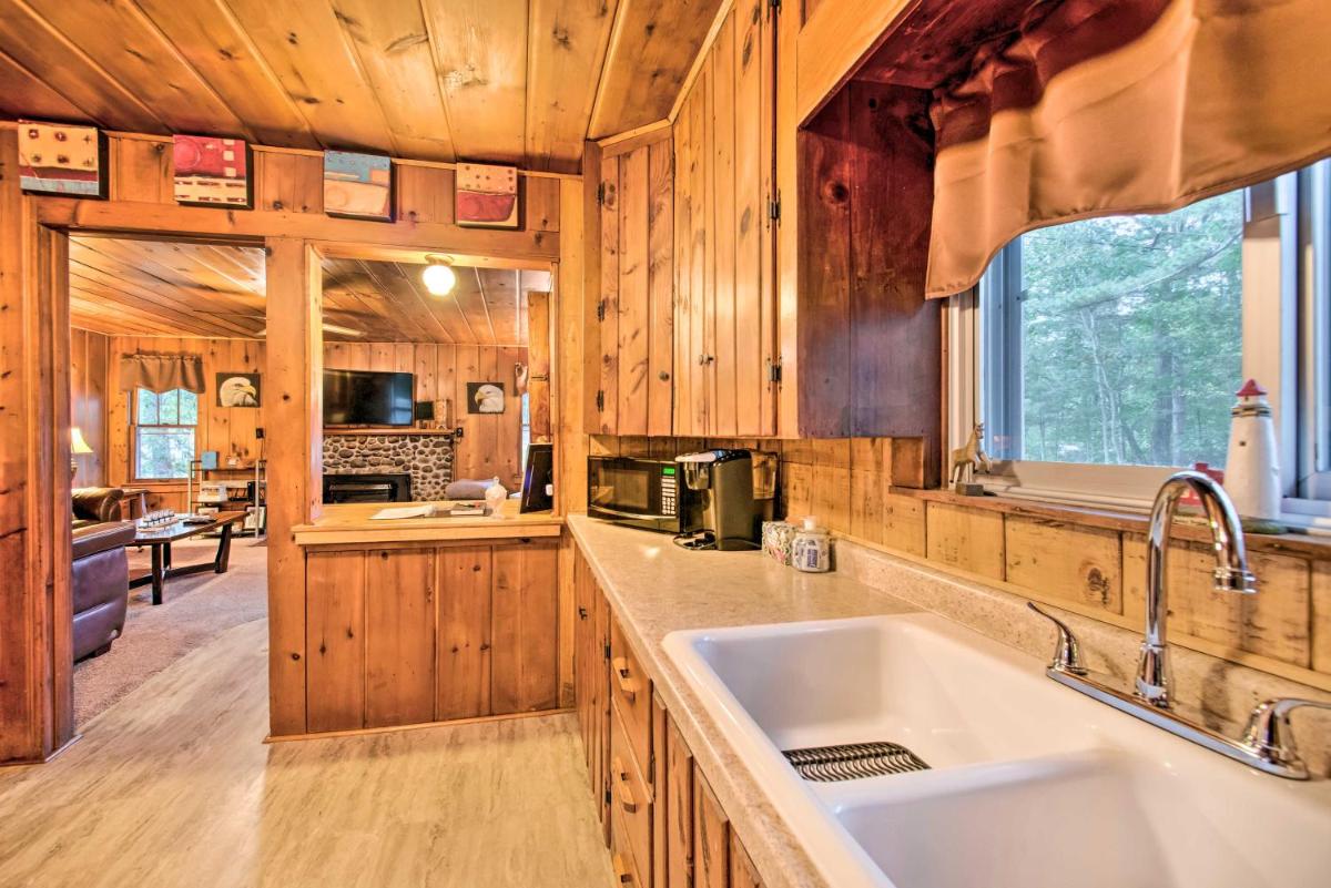 East Tawas Cabin with Deck, Backyard and Fire Pit! - Housity