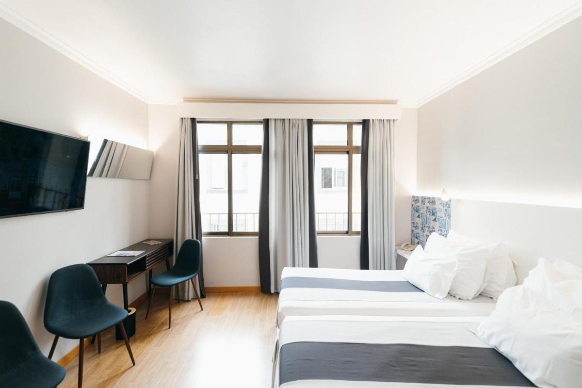 Uma cama ou camas num quarto em Sé Boutique Hotel