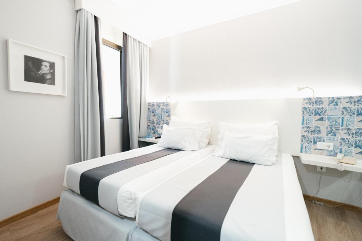 Uma cama ou camas num quarto em Sé Boutique Hotel