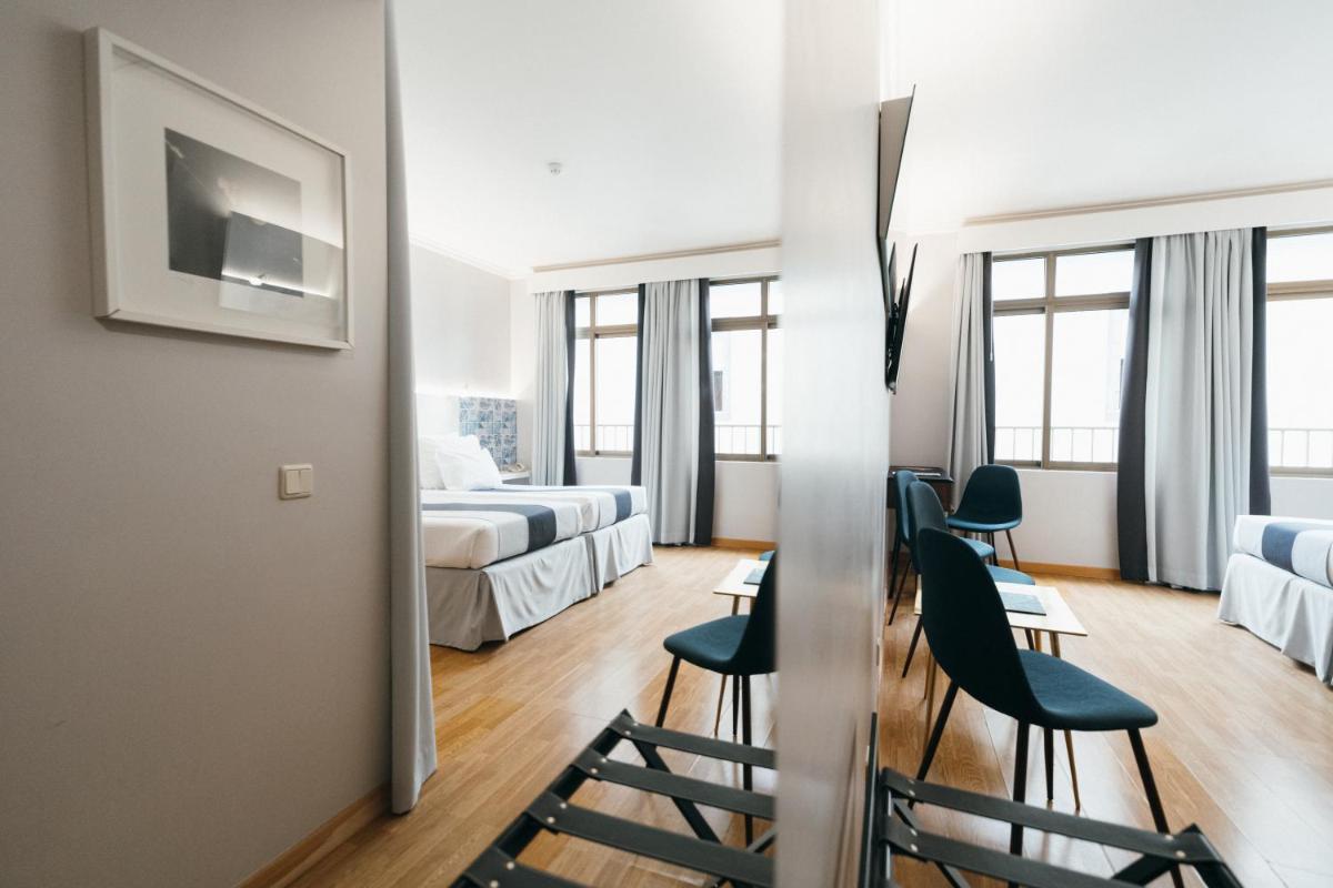 Uma cama ou camas num quarto em Sé Boutique Hotel