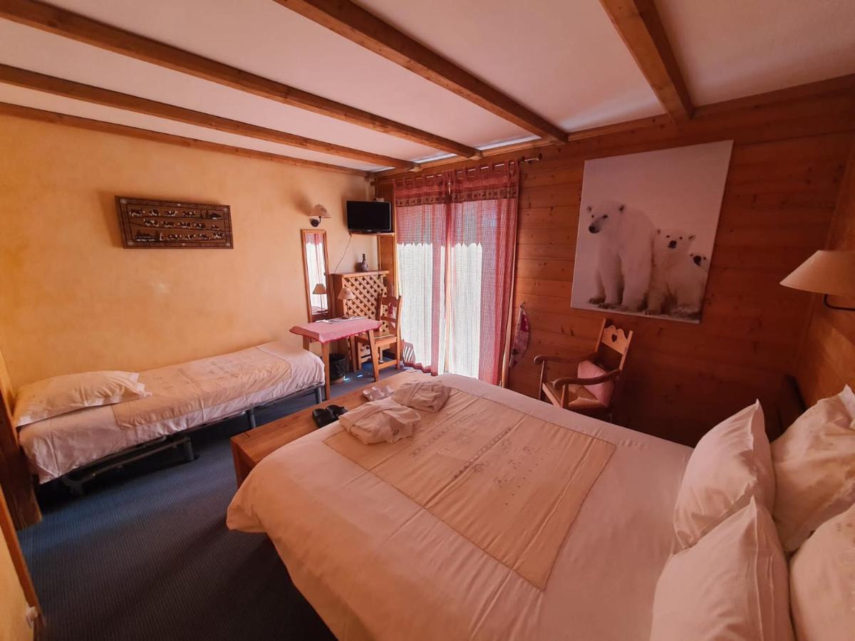 Un ou plusieurs lits dans un hébergement de l'établissement Café-Hôtel Le Morillon, Domaine du Grand Massif-Samoëns