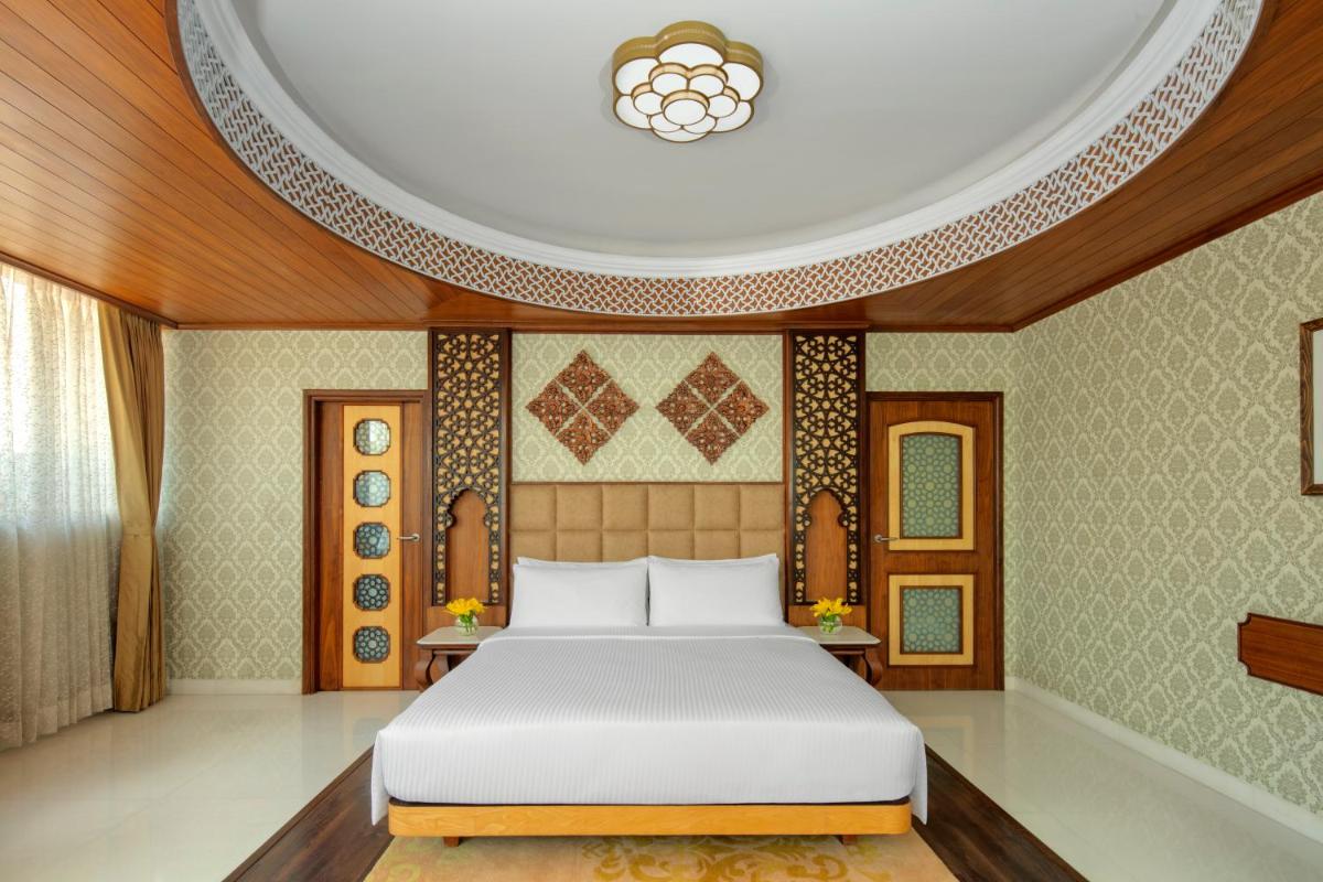 a bedroom with a bed and a round ceiling at Radisson Jodhpur in Jodhpur
