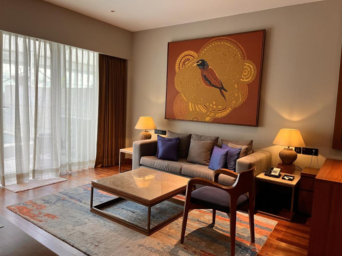 a living room with a couch and a table at Taj City Centre New Town, Kolkata in Kolkata a living room with a couch and a table at Taj City Centre New Town, Kolkata in Kolkata