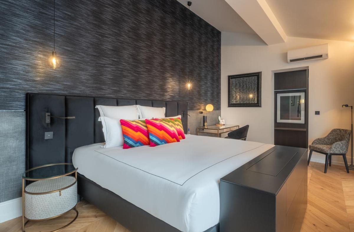 Un ou plusieurs lits dans un hébergement de l'établissement Le Palais Gallien Hôtel & Spa