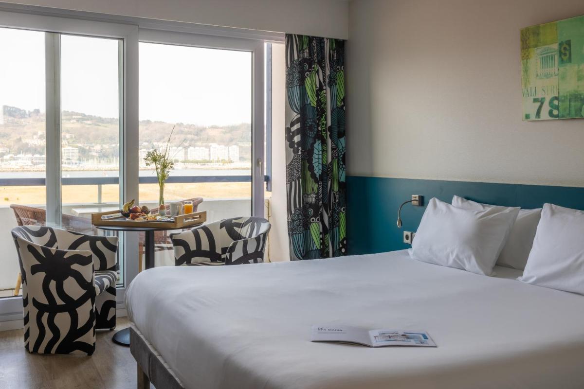 Un ou plusieurs lits dans un hébergement de l'établissement Hôtel Serge Blanco - Relais Thalasso & Spa