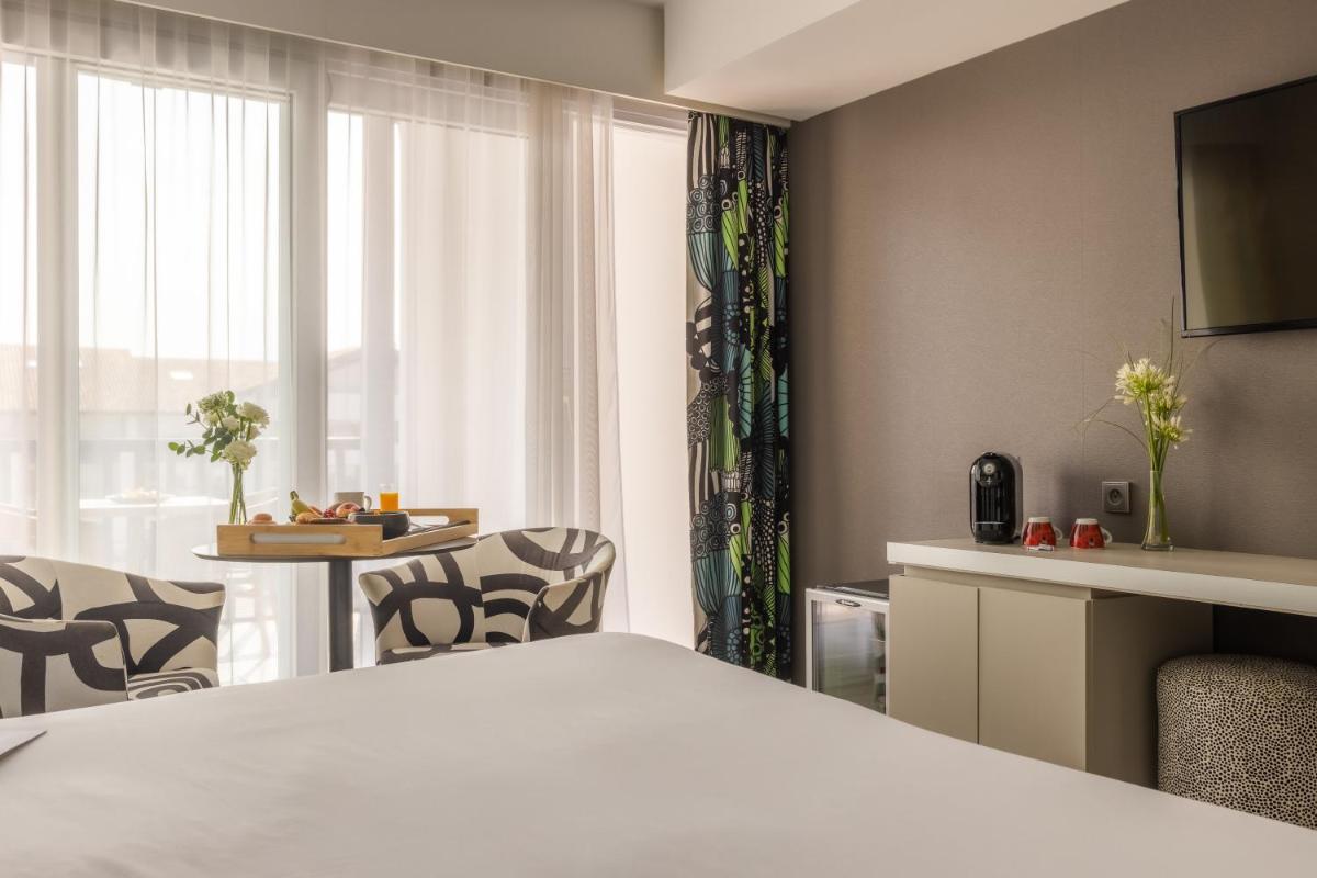 Un ou plusieurs lits dans un hébergement de l'établissement Hôtel Serge Blanco - Relais Thalasso & Spa