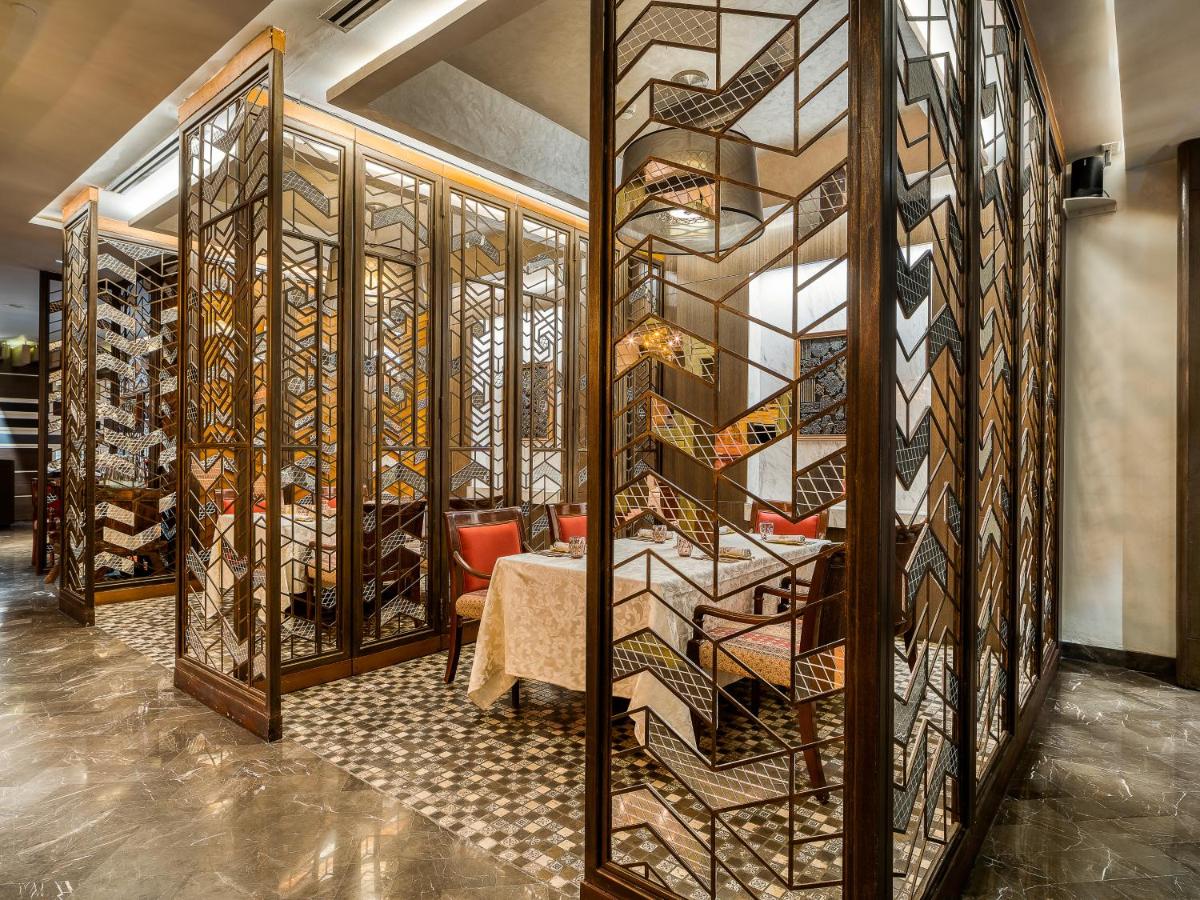 a wine cellar with a wall of wine bottles at Hyatt Regency Ahmedabad in Ahmedabad
