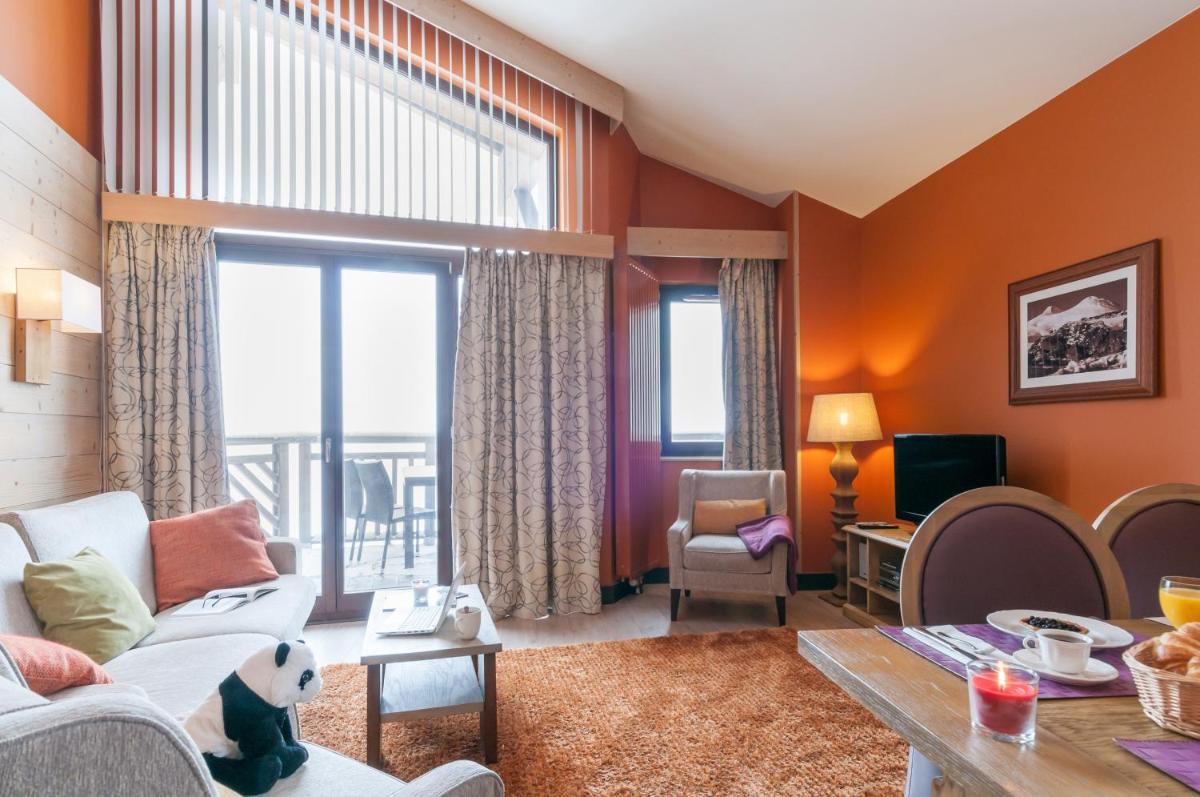 Coin salon dans l'établissement Résidence Pierre & Vacances Premium L'Amara