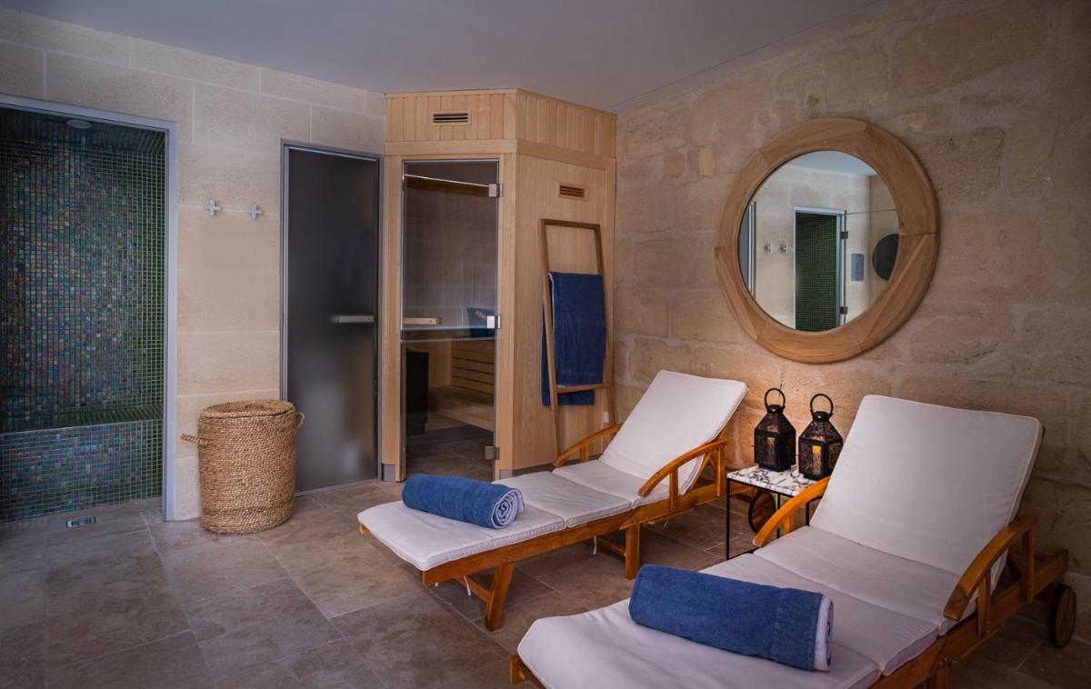 Coin salon dans l'établissement Le Boutique Hotel & Spa