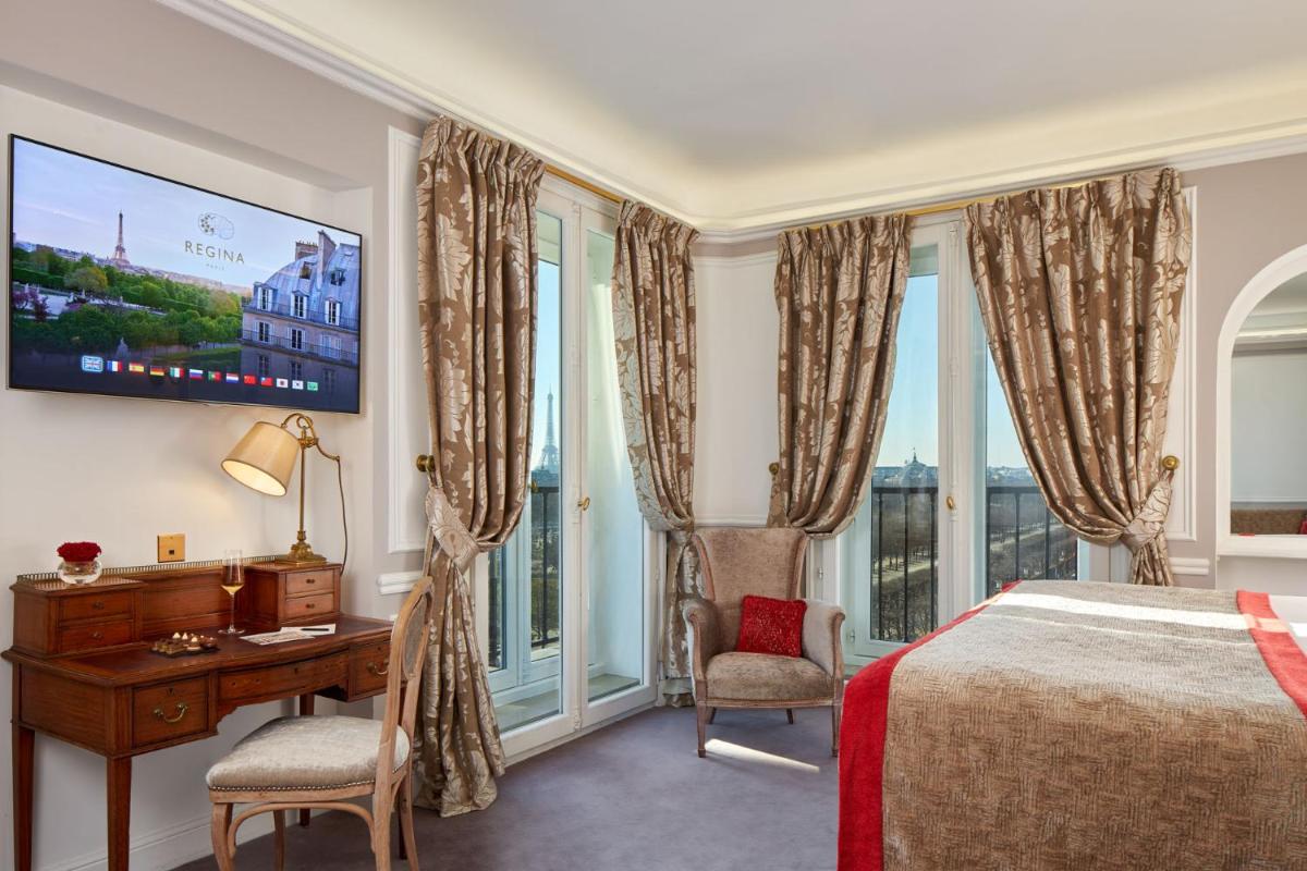 Un ou plusieurs lits dans un hébergement de l'établissement Hôtel Regina Louvre Un ou plusieurs lits dans un hébergement de l'établissement Hôtel Regina Louvre