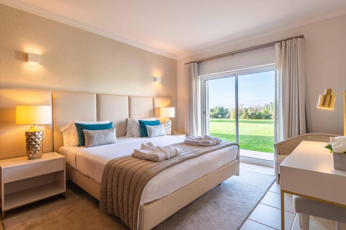 Uma cama ou camas num quarto em Vale d'Oliveiras Quinta Resort & Spa