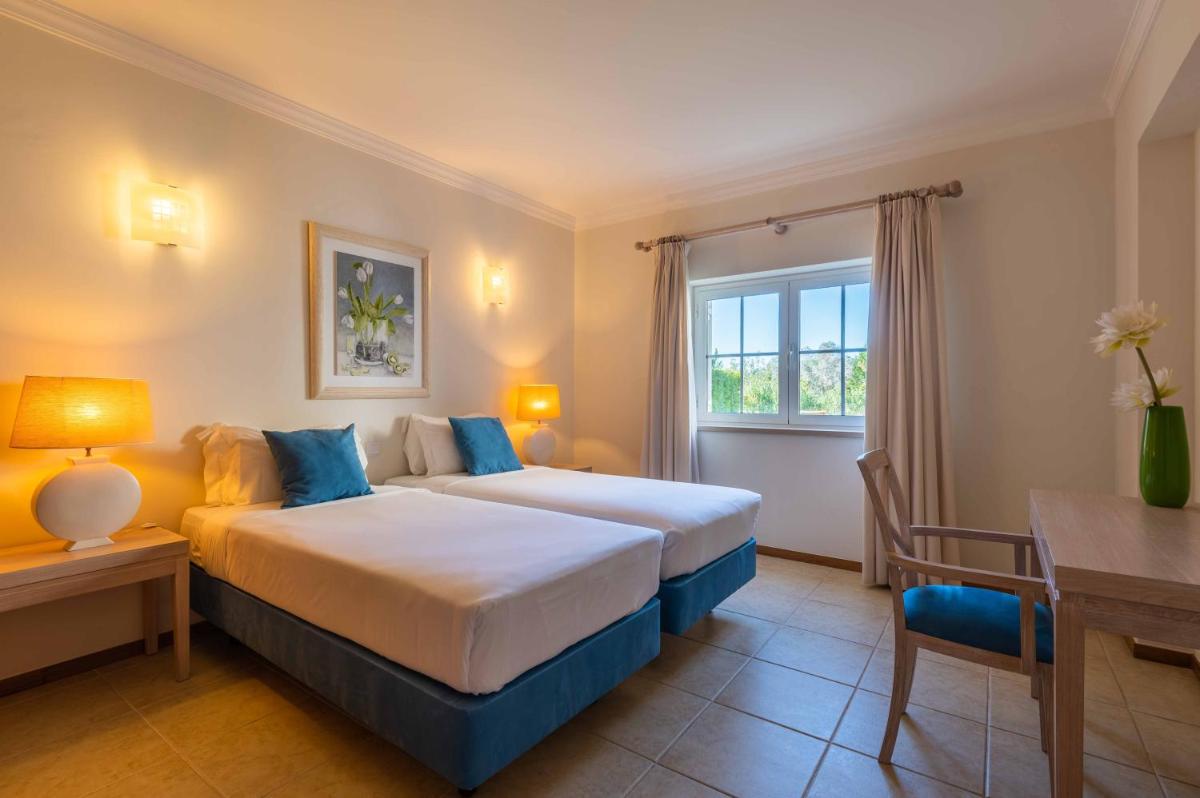 Uma cama ou camas num quarto em Vale d'Oliveiras Quinta Resort & Spa
