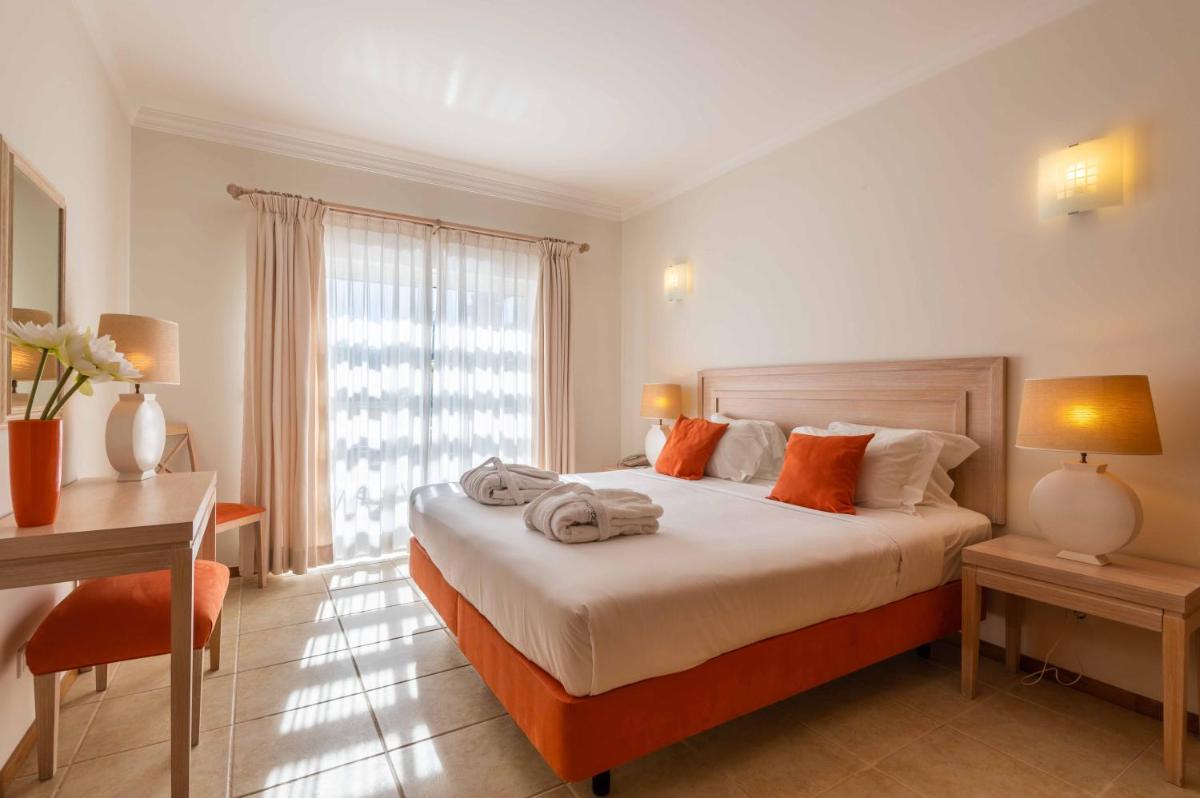 Uma cama ou camas num quarto em Vale d'Oliveiras Quinta Resort & Spa