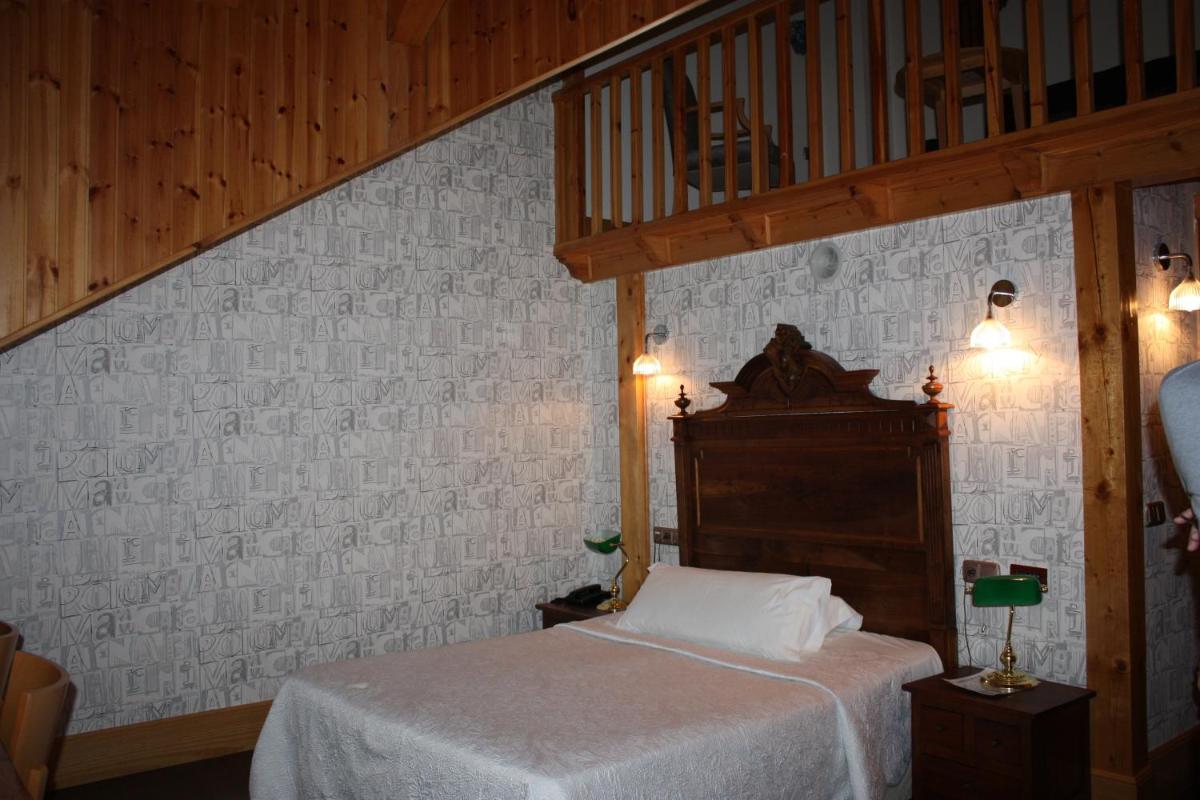 Cama o camas de una habitación en Hotel Balneario La Hermida