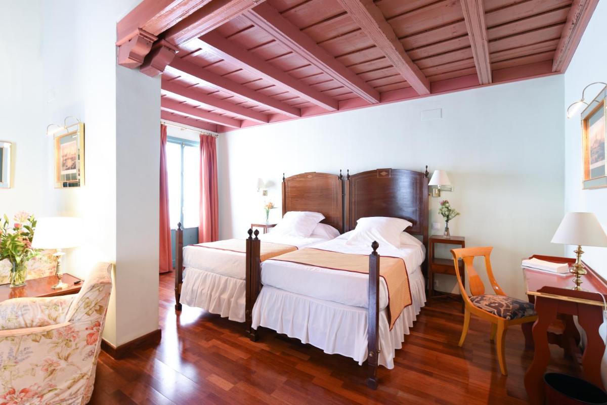 Cama o camas de una habitación en Hotel Las Casas de la Judería