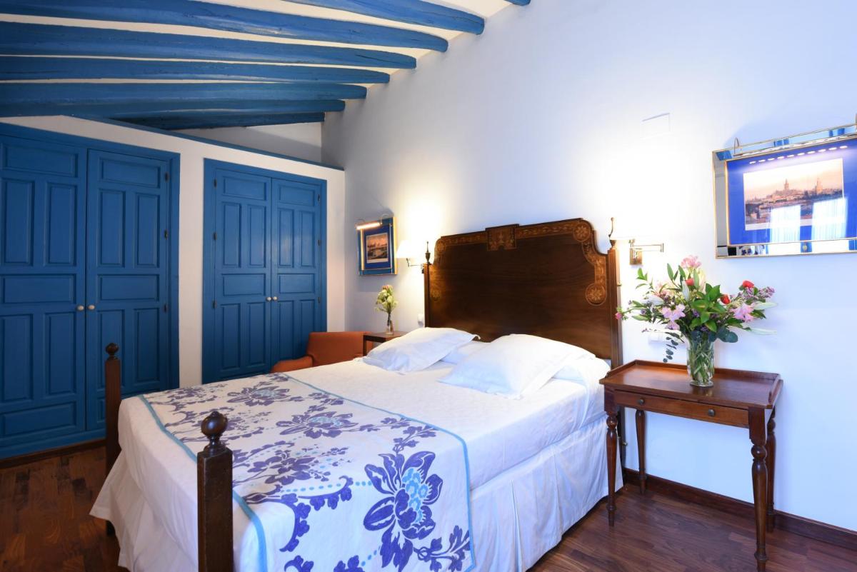 Cama o camas de una habitación en Hotel Las Casas de la Judería