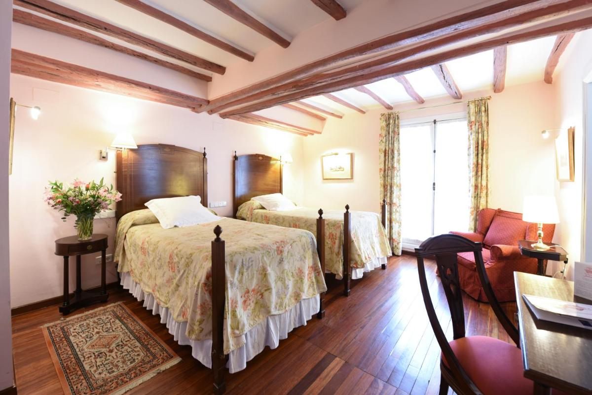 Cama o camas de una habitación en Hotel Las Casas de la Judería