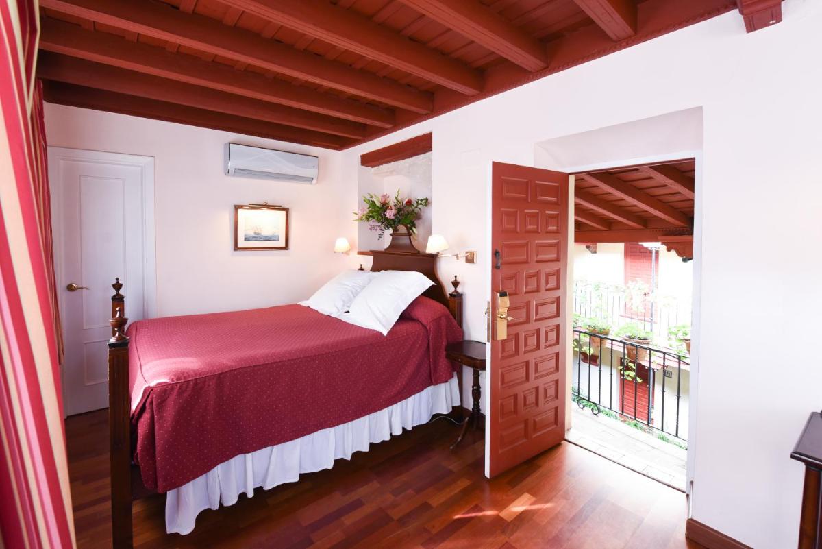 Cama o camas de una habitación en Hotel Las Casas de la Judería