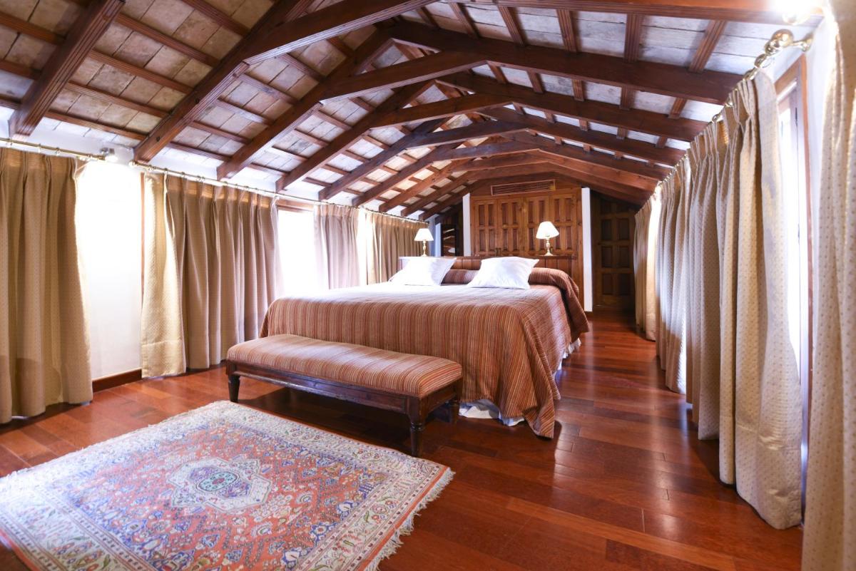 Cama o camas de una habitación en Hotel Las Casas de la Judería