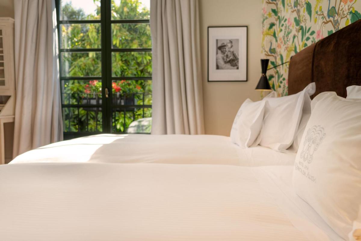 Cama o camas de una habitación en A Quinta Da Auga Hotel Spa Relais & Chateaux