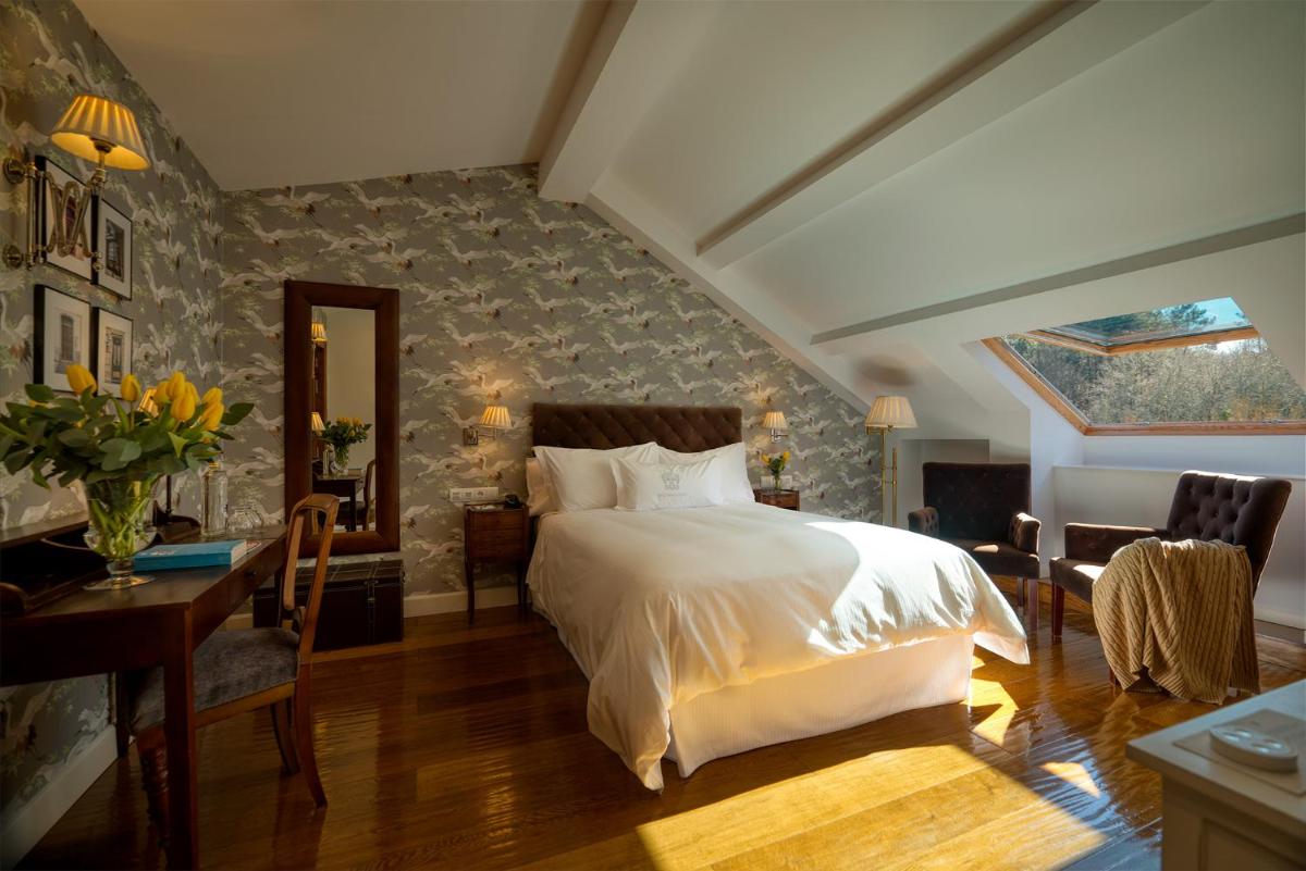Cama o camas de una habitación en A Quinta Da Auga Hotel Spa Relais & Chateaux