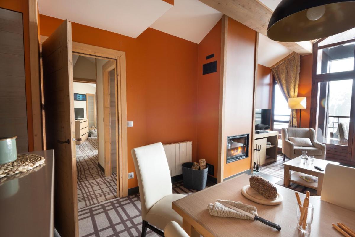 Coin salon dans l'établissement Résidence Pierre & Vacances Premium Les Terrasses d'Hélios
