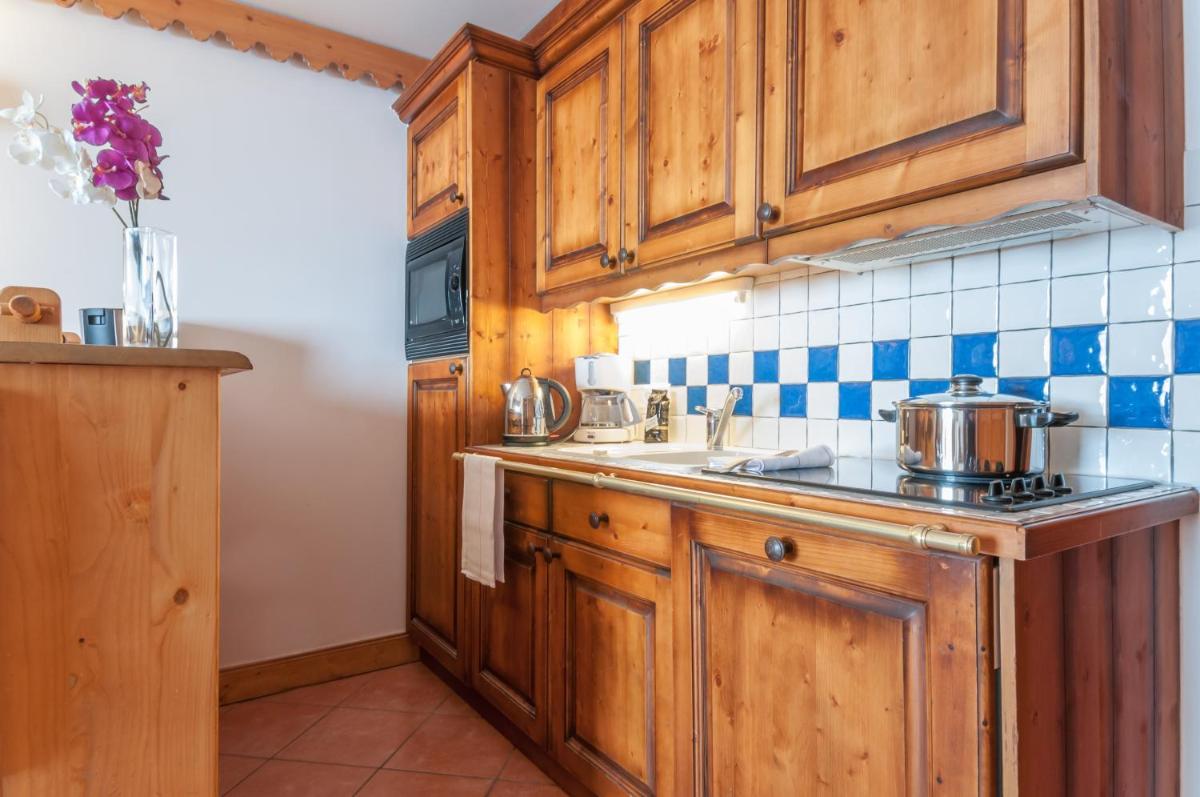 Cuisine ou kitchenette dans l'établissement Résidence Pierre & Vacances Premium Les Hauts Bois