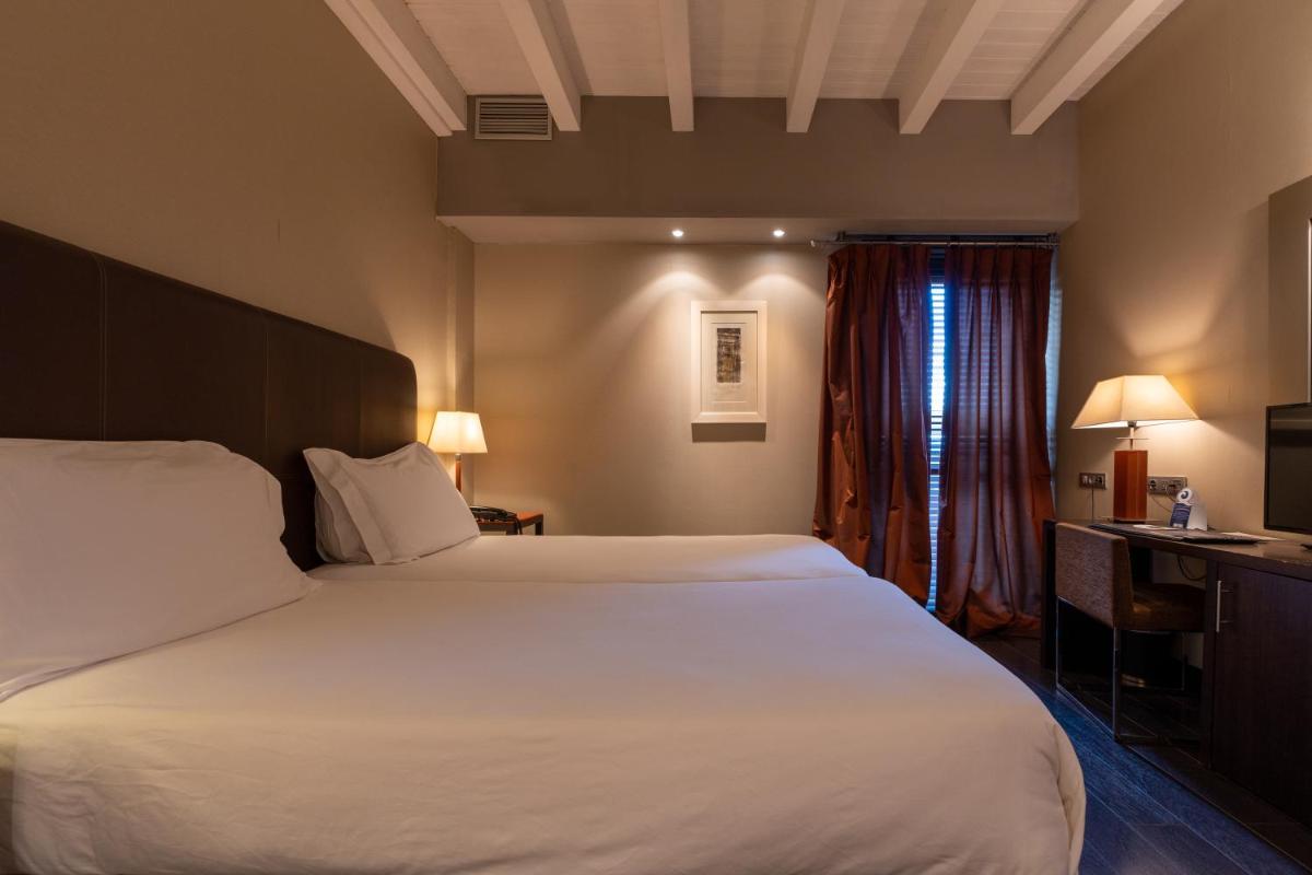 Cama o camas de una habitación en Hotel La Trufa Negra