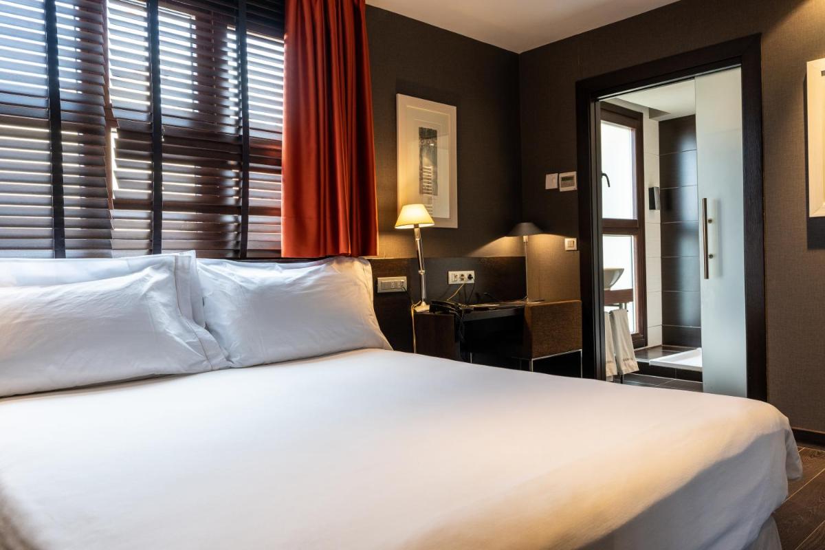 Cama o camas de una habitación en Hotel La Trufa Negra