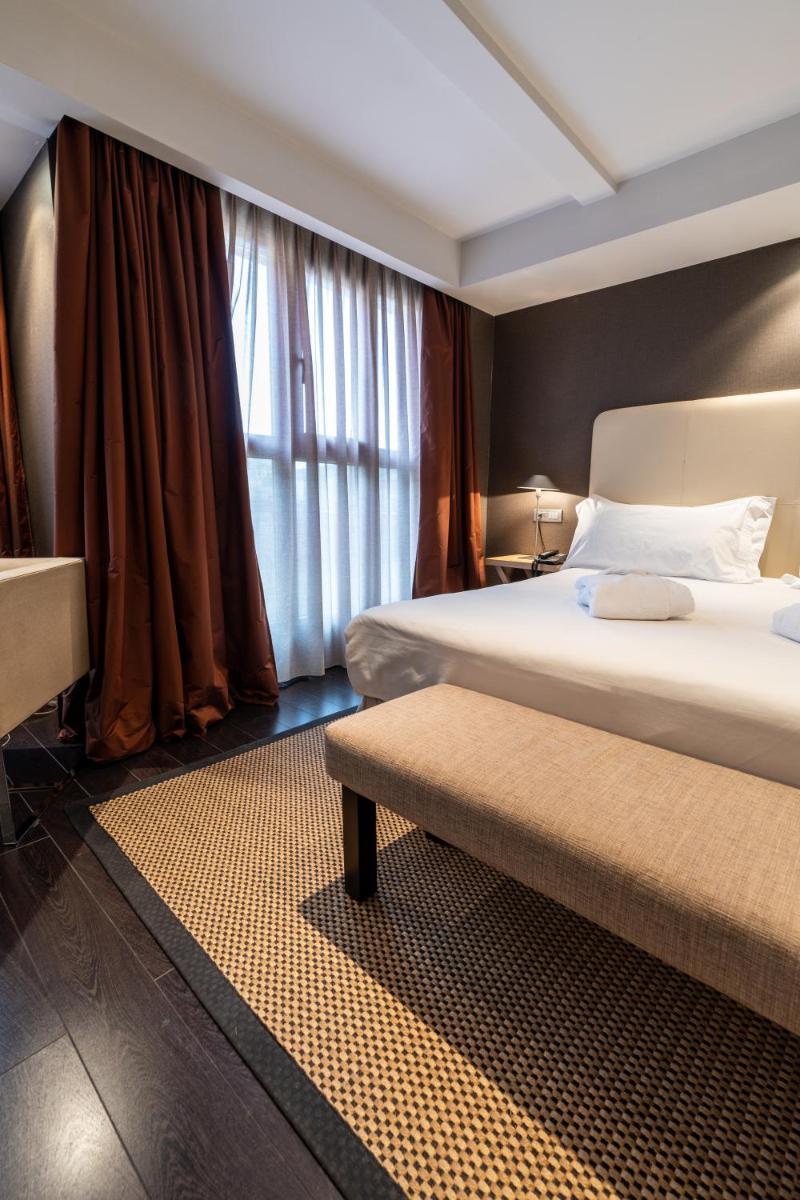 Cama o camas de una habitación en Hotel La Trufa Negra