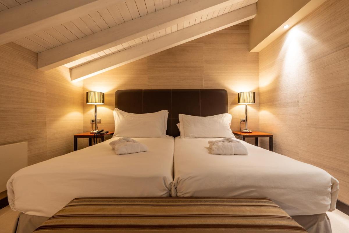 Cama o camas de una habitación en Hotel La Trufa Negra