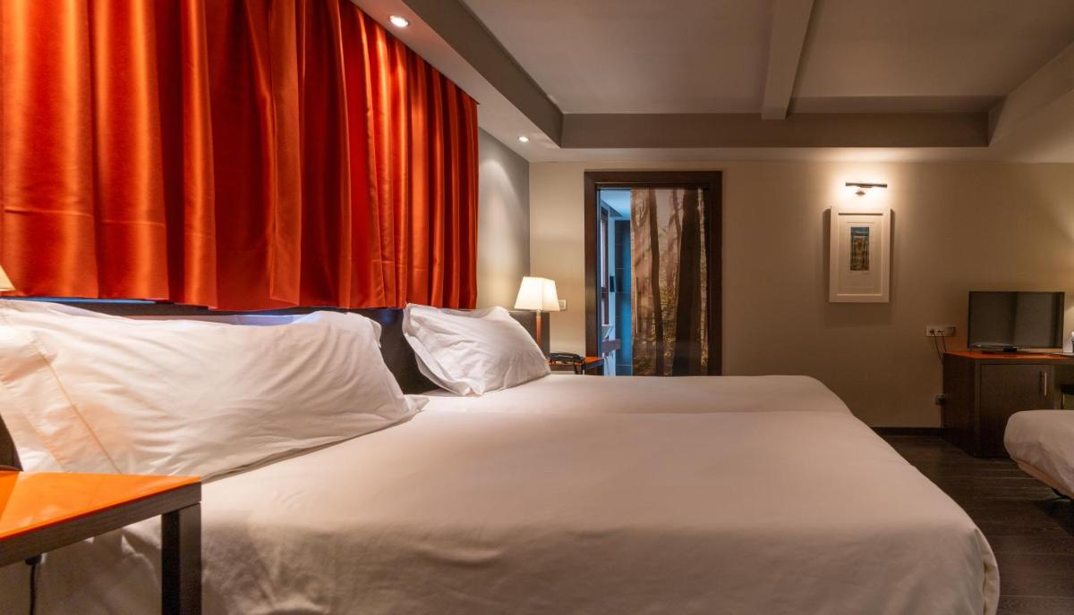 Cama o camas de una habitación en Hotel La Trufa Negra