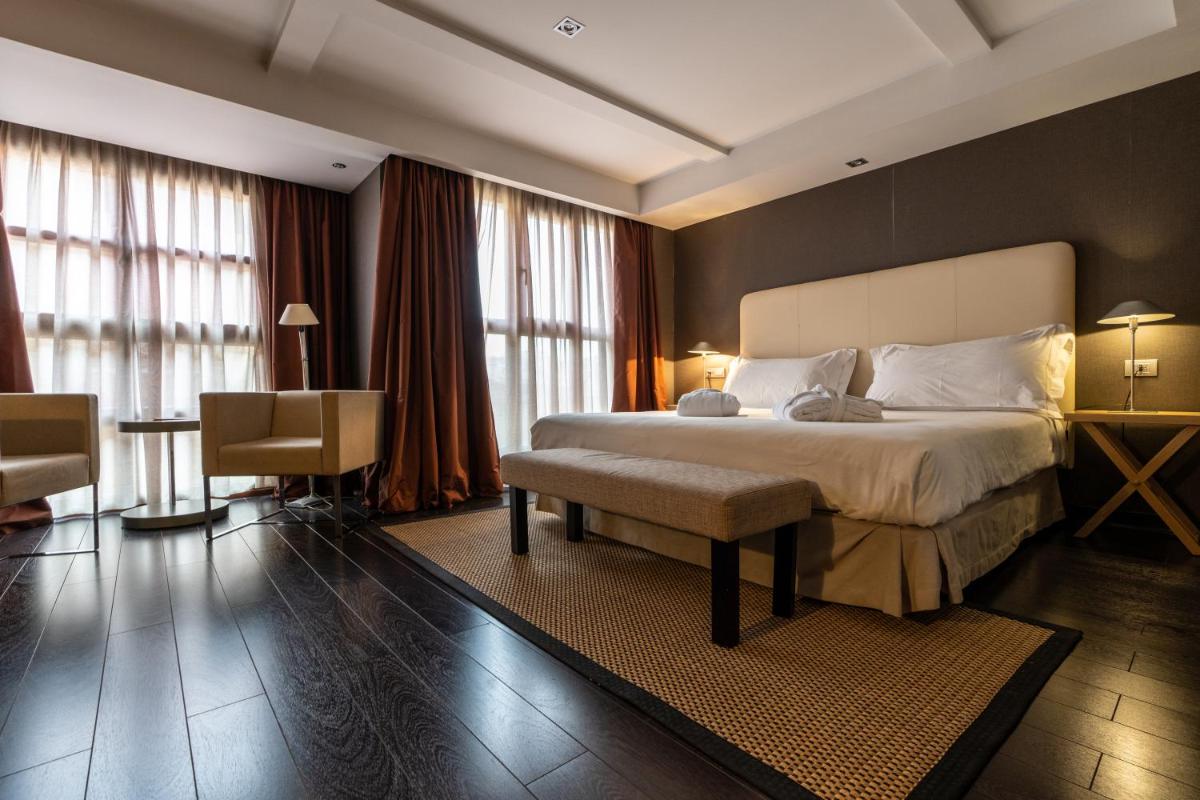 Cama o camas de una habitación en Hotel La Trufa Negra