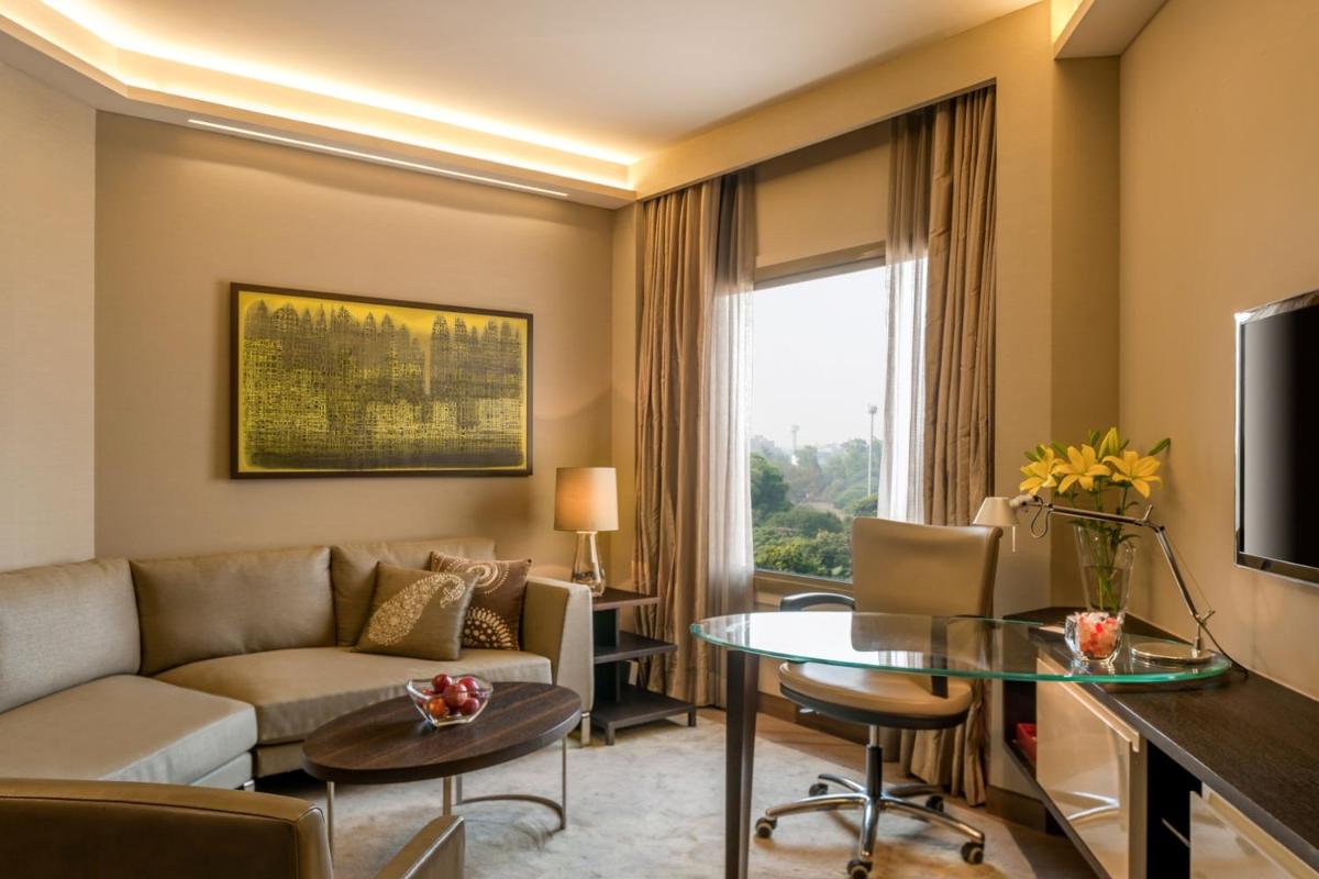 a living room with a couch and a table at Hyatt Regency Delhi in New Delhi a living room with a couch and a table at Hyatt Regency Delhi in New Delhi