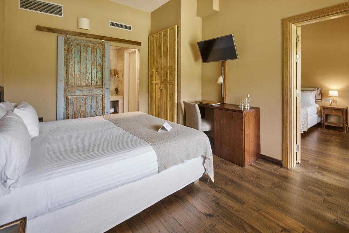 Cama o camas de una habitación en Mas Salagros EcoResort & SPA